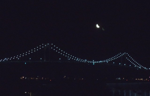 Crescent moon over Newport Bridge.???